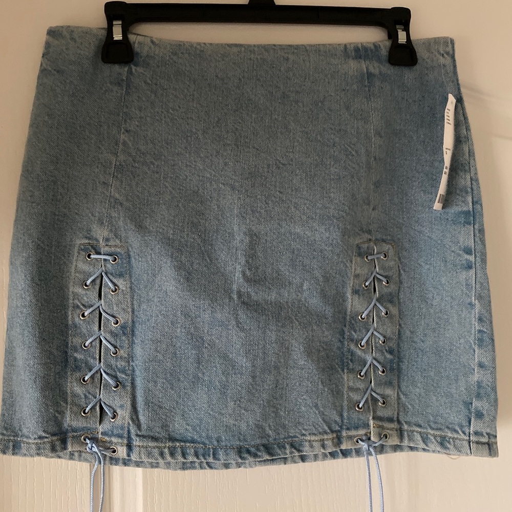 Urban Outfitters light-wash denim skirt w/lace up slits. NWT.  15" LENGTH